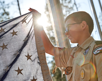 boy raising a flag