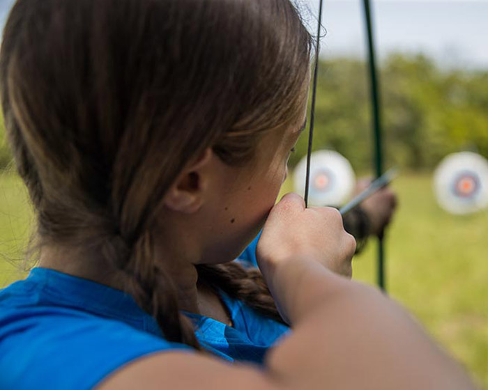 Girl shooting bow