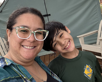 Smiling in front of tent